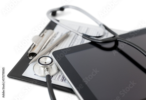Digital tablet with stethoscope and clipboard photo