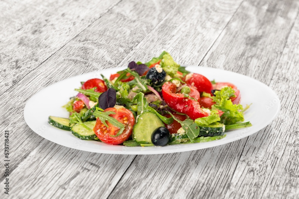 Fresh tasty salad with vegetables in bowl Fresh tasty salad with vegetables in bowl