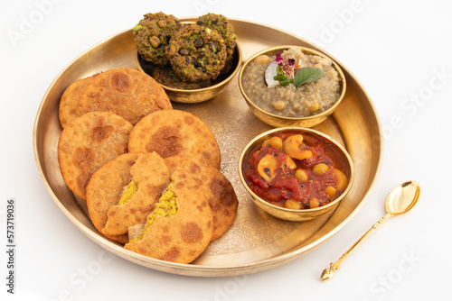 Dal Bhari Poori, Dholl Puri, Cholar Dal, Luchi Served With Gur Ki Kheer Or Jaggery Rice Pudding, Nolen Gurer Payesh, Rasiya, Payasam, Hara Chana Or Chholia Pakoda Bhabhra, Tamatar Ki Meethi Chutney photo