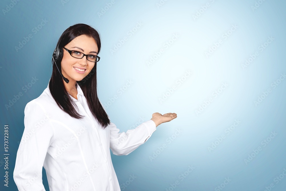 Portrait of attractive young business woman with headset