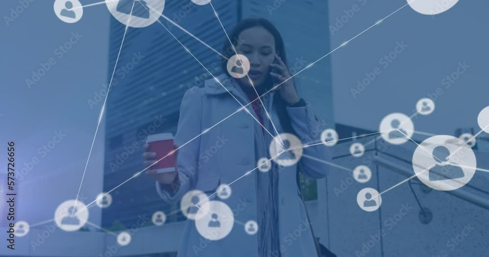 Animation of network of profile icons over african american woman talking on smartphone on stairs Animation of network of profile icons over african american woman talking on smartphone on stairs