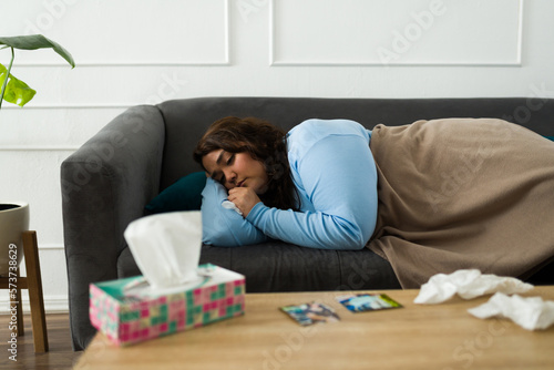 Upset heartbroken woman crying resting on the sofa
