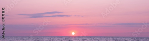 Fototapeta Naklejka Na Ścianę i Meble -  Beautiful panorama of sky over sea at sunset. Banner design