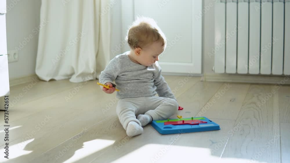 Little girl playing with educational toy. Cute girl playing intellectual toys Little girl playing with educational toy. Cute girl playing intellectual toys