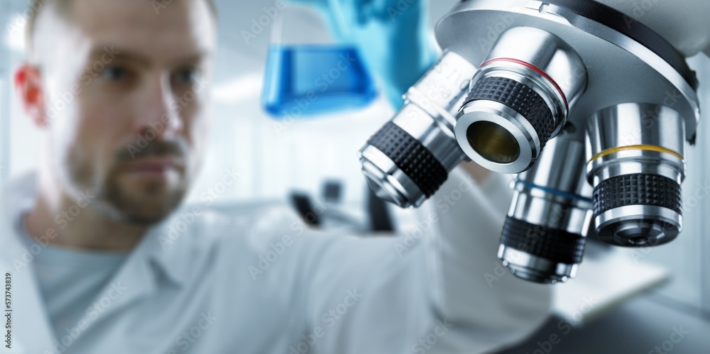 Scientist person working with microscope in laboratory. Scientist person working with microscope in laboratory.