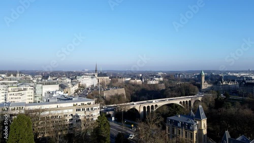 ascending drone shot over Luxembourg city center bridge golden lady photo