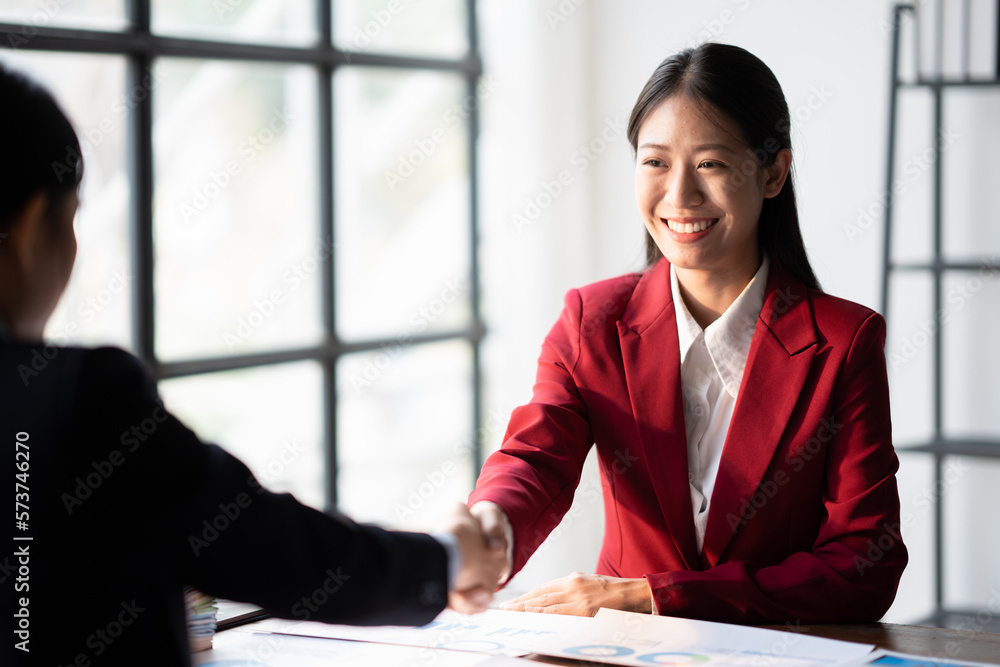 Partnership concept. two business people shaking hand after business signing contract in meeting room at company office. Partnership concept. two business people shaking hand after business signing contract in meeting room at company office.
