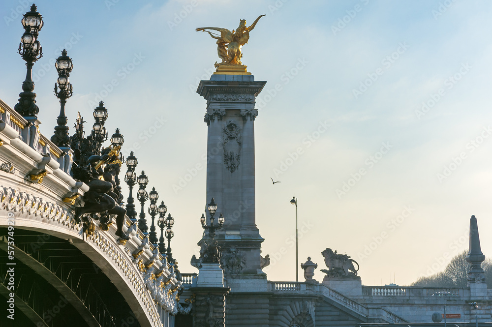 Fototapeta premium Alexandre III bridge against hazy blue sky in Paris, France
