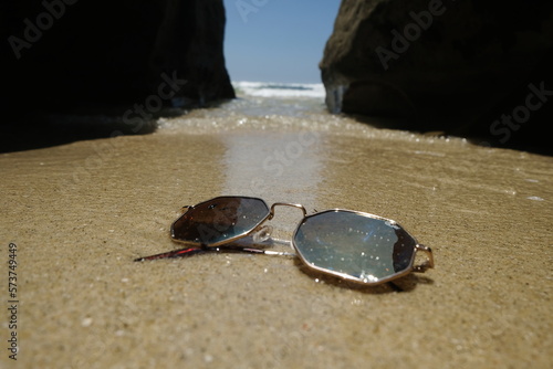 sunglasses on sand