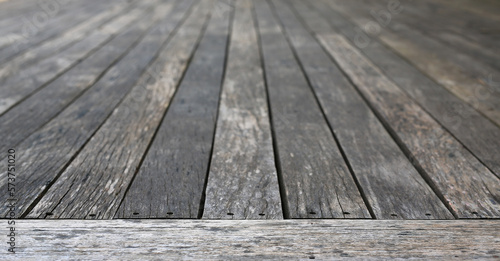 Old vintage planked wood table in perspective for background.