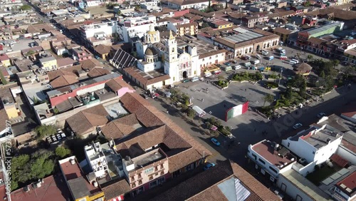 Chignahuapan, Puebla Mexico. Nov 23 2022. Panoramic drone view of the indigenous Baroque church Parroquia de Santiago Apóstol in the central Plaza de Armas. photo