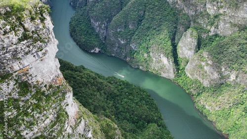 Aerial view of the majestic Canyon del Sumidero in Mexico. Flight over the canyon in the clouds.