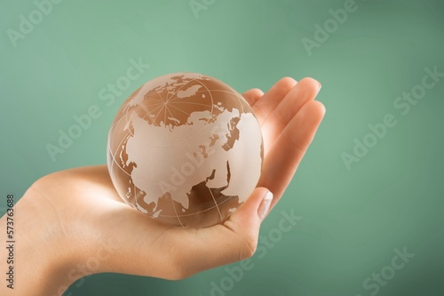 Concept of Earth Day. Hands hold a Globe.