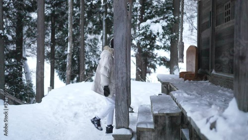 Wallpaper Mural Young Asian man in winter coat pray in traditional Japanese shrine on forest mountain covered in snow day. Handsome guy traveler travel nature and Japanese culture in Japan on winter holiday vacation. Torontodigital.ca
