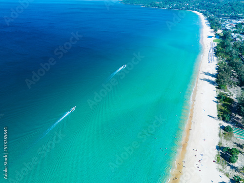 Aerial View Amazing beach with travel people relaxation on the beach,Beautiful sea in summer season at Phuket island Thailand,Travel people on beach,Beach during summer with many resting people