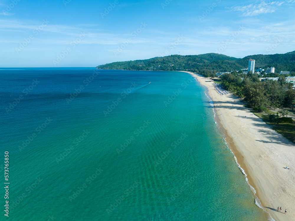 Aerial View Amazing beach with travel people relaxation on the beach,Beautiful sea in summer season at Phuket island Thailand,Travel people on beach,Beach during summer with many resting people