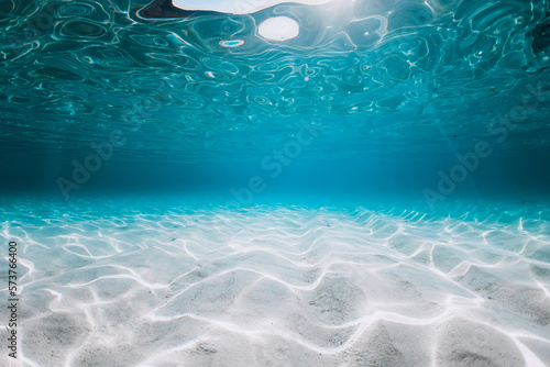 Fototapeta Turquoise ocean with sand underwater in Florida. Ocean background