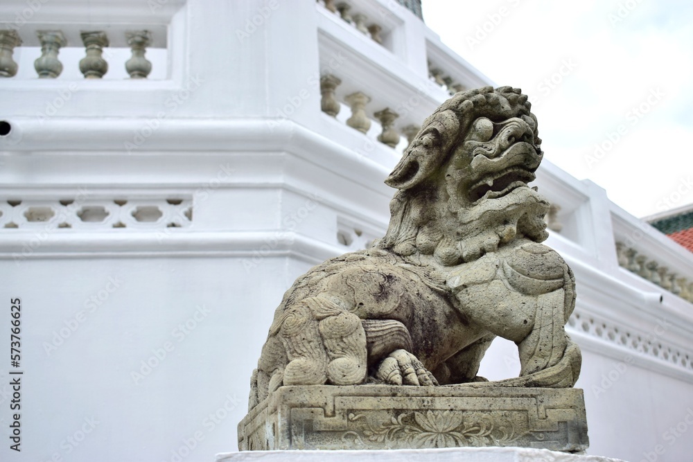 The statue of the ancient lion is the symbol of the guardian who protect the religious place.
