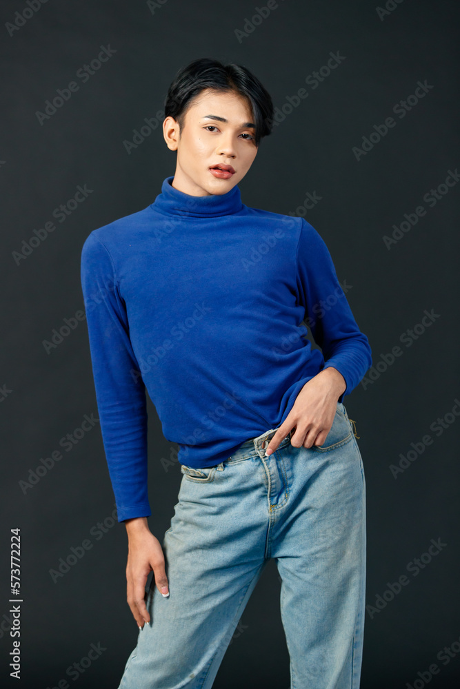 Portrait isolated cutout studio half body shot of Asian young sexy luxury glamour slim fashionable LGBTQ gay male model in turtleneck long sleeve shirt denim jeans standing posing on black background Portrait isolated cutout studio half body shot of Asian young sexy luxury glamour slim fashionable LGBTQ gay male model in turtleneck long sleeve shirt denim jeans standing posing on black background