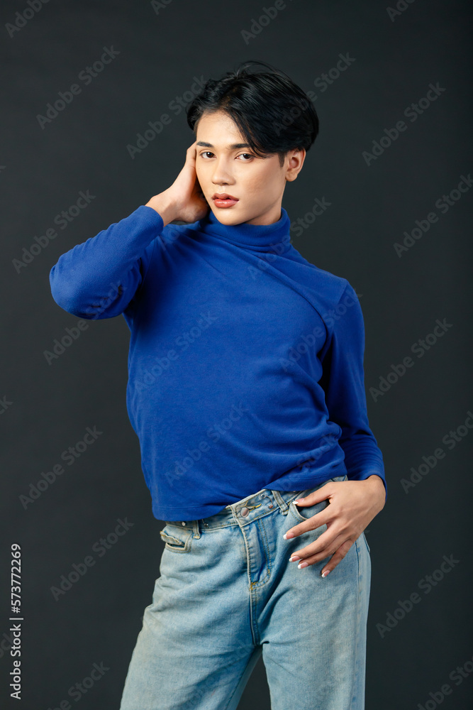 Portrait isolated cutout studio half body shot of Asian young sexy luxury glamour slim fashionable LGBTQ gay male model in turtleneck long sleeve shirt denim jeans standing posing on black background Portrait isolated cutout studio half body shot of Asian young sexy luxury glamour slim fashionable LGBTQ gay male model in turtleneck long sleeve shirt denim jeans standing posing on black background