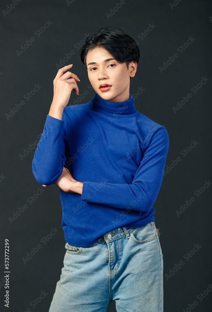 Portrait isolated cutout studio half body shot of Asian young sexy luxury glamour slim fashionable LGBTQ gay male model in turtleneck long sleeve shirt denim jeans standing posing on black background Portrait isolated cutout studio half body shot of Asian young sexy luxury glamour slim fashionable LGBTQ gay male model in turtleneck long sleeve shirt denim jeans standing posing on black background