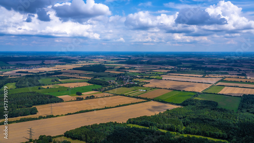 Aerial view of green meadows and yellow fields in Lower Saxony