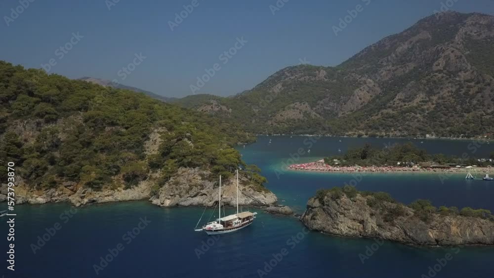 Aerial orbits tourist ship in shallow bay in Turkish Mediterranean Aerial orbits tourist ship in shallow bay in Turkish Mediterranean