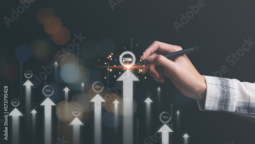 businessman shows the concept of Performance increase in the business of finance and investment, improvement and development from indicators to develop towards the goal, process of industrial growth photo
