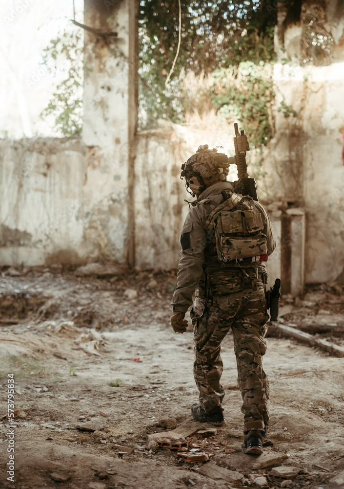 Military soldier in the war. Concept of military special forces with arms Military soldier in the war. Concept of military special forces with arms