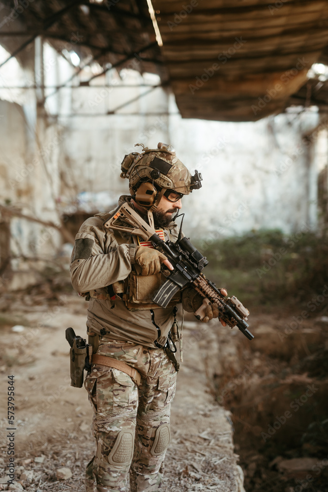 Fototapeta premium Military soldier in the war. Concept of military special forces with arms