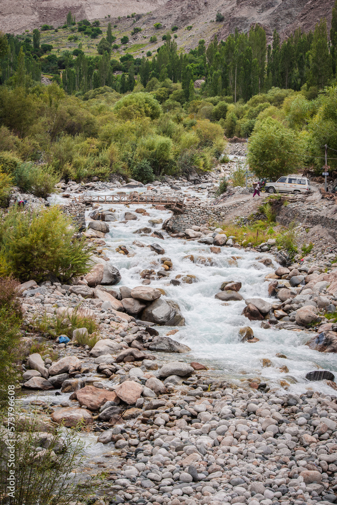 beautiful scene of the creek and wooden Bridge in Turtuk village, Nubra valley, leh ladakh, India. beautiful scene of the creek and wooden Bridge in Turtuk village, Nubra valley, leh ladakh, India.