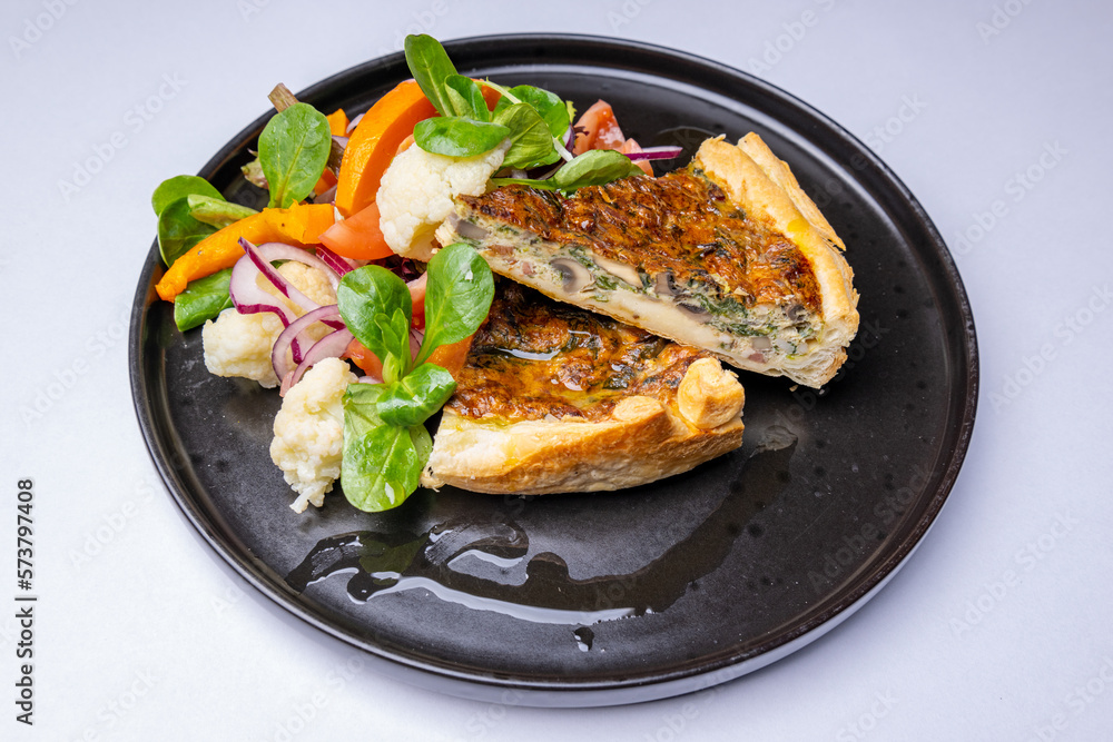 Spinach and mushroom quiche with fresh salad Spinach and mushroom quiche with fresh salad