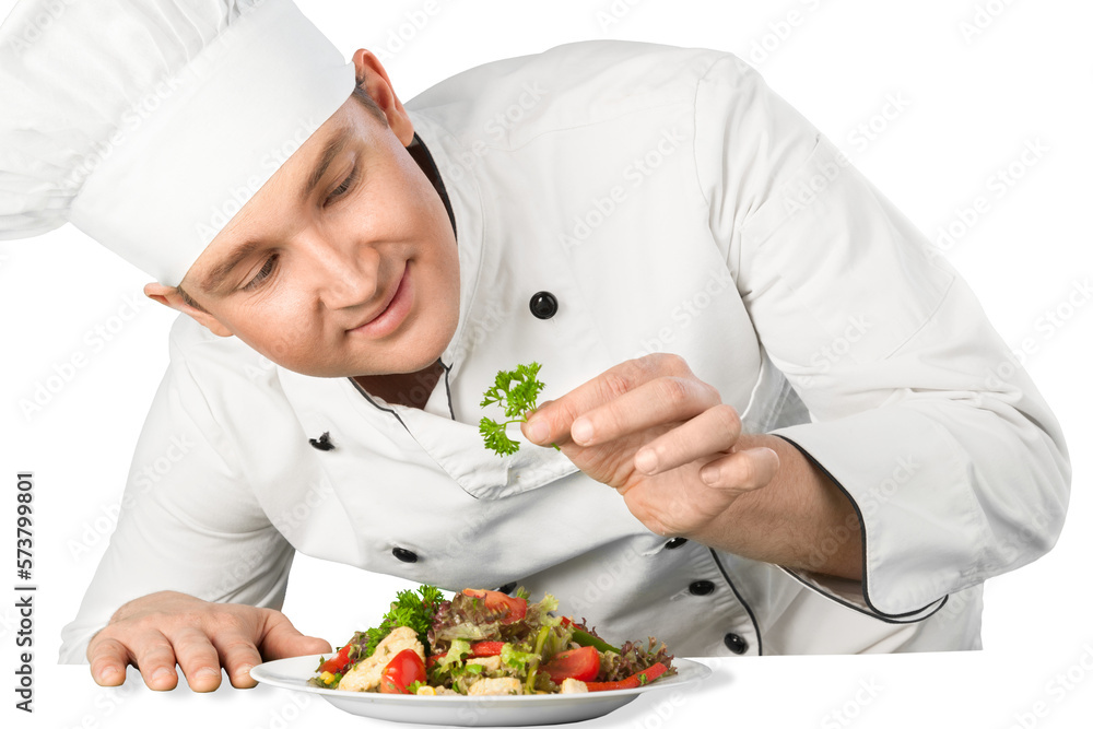 Portrait of a male chef cook preparing salad isolated on a white background Portrait of a male chef cook preparing salad isolated on a white background