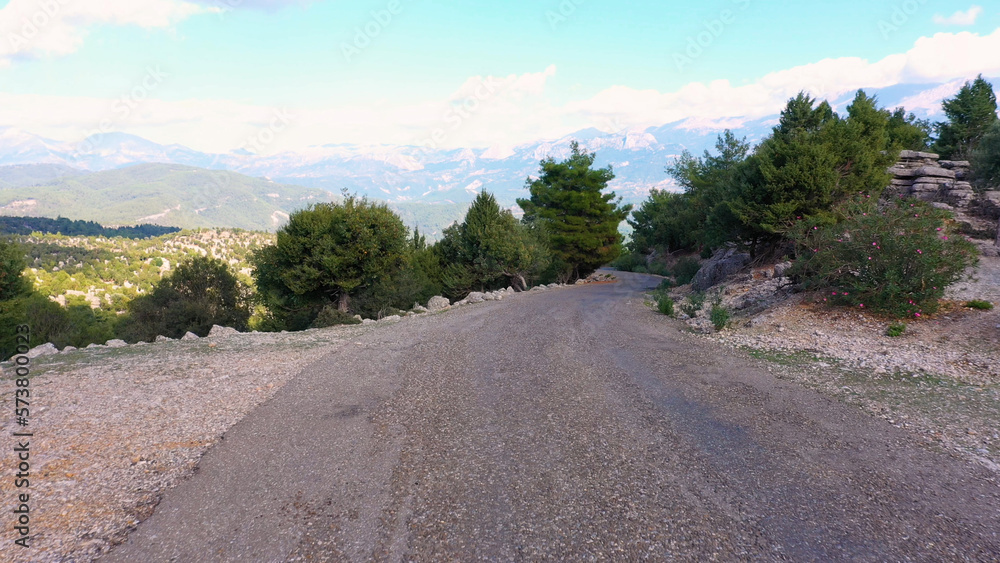Winding road and mountains. Aerial panoramic view from drone. Travel to mountains.