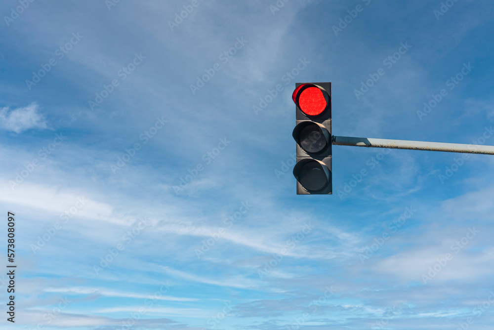 Ταπετσαρία Modern traffic light with red light in front of cloudless sunny blue sky