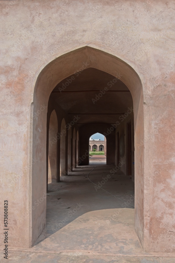  symmetrical exterior corridor with arches and columns in the Serai   Nurmahal , Historical Monument , Punjab, India