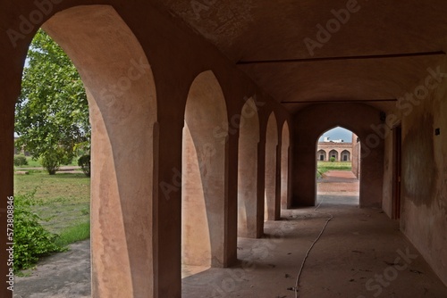  symmetrical exterior corridor with arches and columns in the Serai Nurmahal , Historical Monument , Punjab, India
