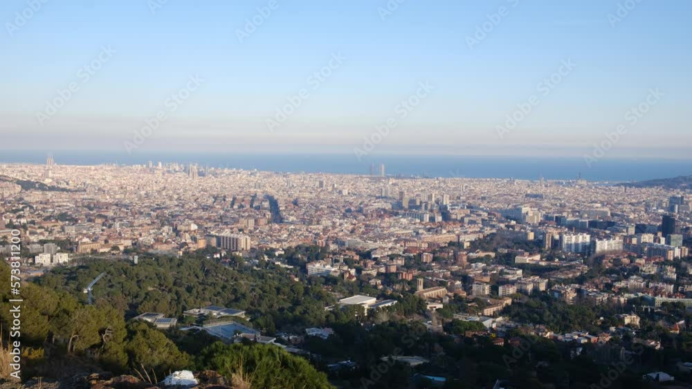 Enjoy a breathtaking panoramic view of the city of Barcelona that will leave you speechless. Observe the majesty of its iconic buildings, its blue sky, and the Mediterranean Sea, all in one image. Enjoy a breathtaking panoramic view of the city of Barcelona that will leave you speechless. Observe the majesty of its iconic buildings, its blue sky, and the Mediterranean Sea, all in one image.