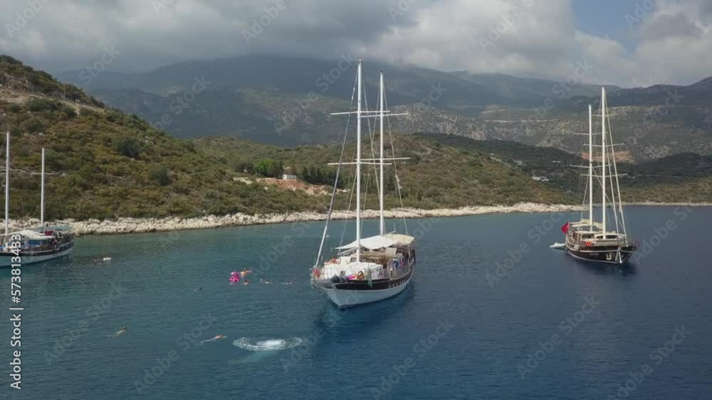 Caucasian male tourist swan dives off bowsprit of moored tourist ship Caucasian male tourist swan dives off bowsprit of moored tourist ship