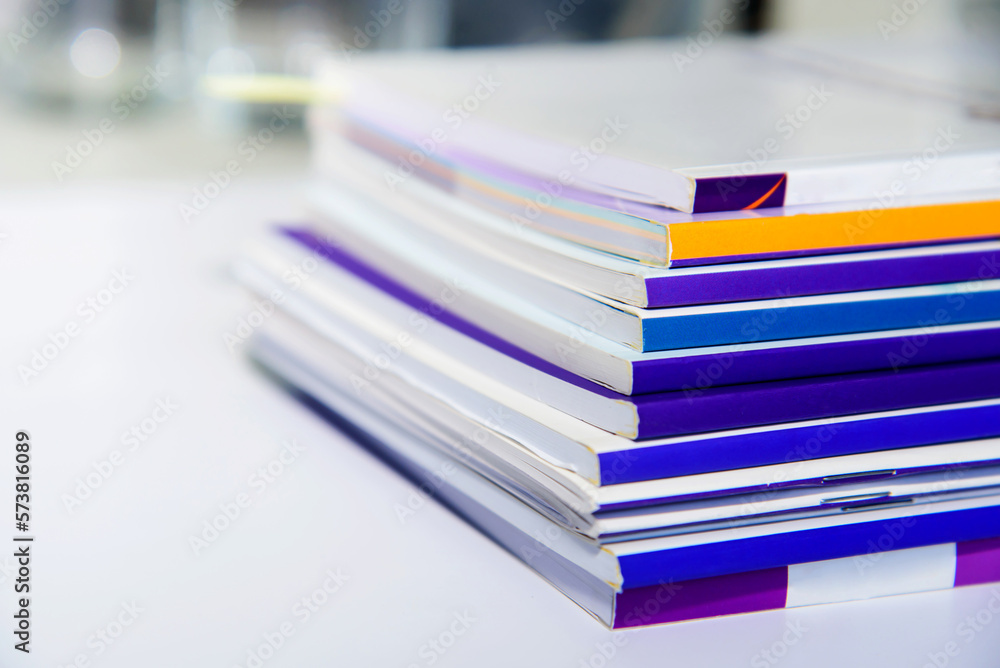 Stack of books on the desk in office. Selective focus. Stack of books on the desk in office. Selective focus.