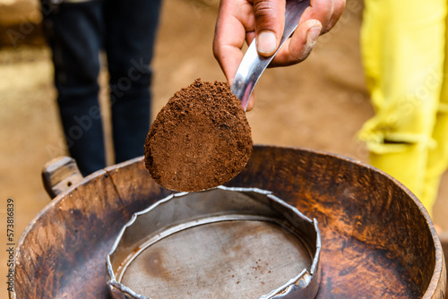 Preparing coffee in Chagga tribe near the Moshi town photo