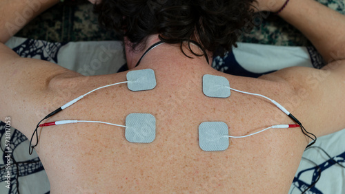 Harnessing Technology for Relaxation and Rehabilitation, Exploring the Benefits of Electronic Stimulation in Physical Therapy, Revitalizing the Body with Electronic Stimulation,  photo