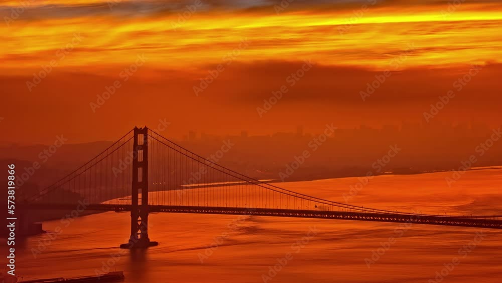 Ship sail under Golden Gate Bridge, fusion time lapse with vibrant colors Ship sail under Golden Gate Bridge, fusion time lapse with vibrant colors