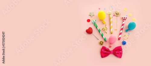 Top view image of party and present objects on pastel background