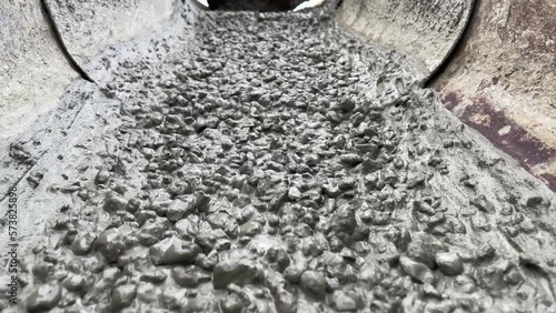 Pouring concrete mix on concreting formwork. Slow Motion