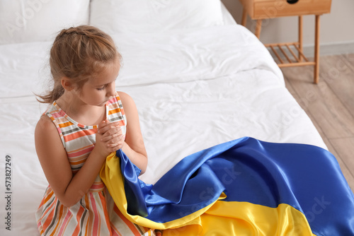 Little girl with flag of Uk...