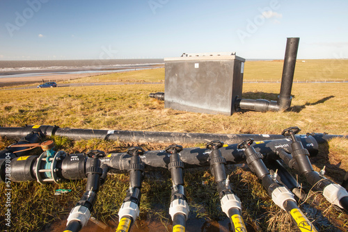 Methane, extracted from an old landfill site on Walney Island, to power a biogas generator producing green electricity, Cumbria, UK