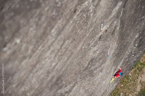 Man climbing on the granite of Premia Balmafredda's crag. Premia, Ossola, Italy. photo