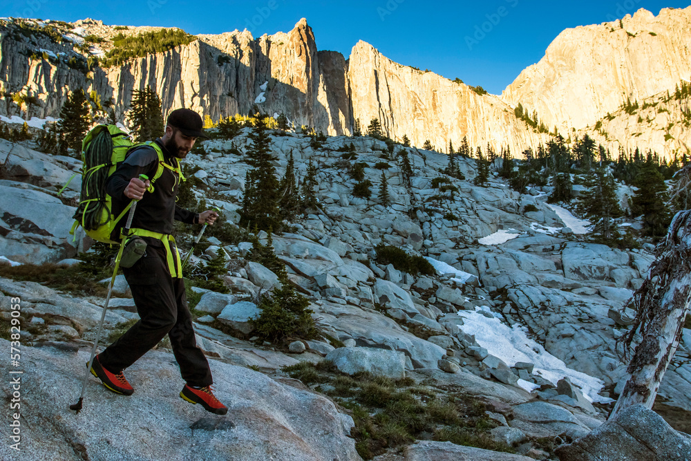 A Man Hiking Down At Utah's Lone Peak Located In The Wasatch Mountains A Man Hiking Down At Utah's Lone Peak Located In The Wasatch Mountains