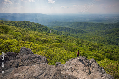 Hiker standing at edge of Humpback Rock, Virginia, USA photo